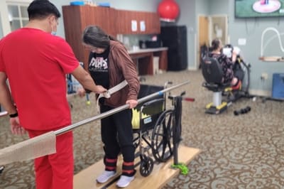 Residents participating in physical therapy exercises