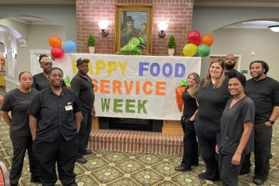 Staff celebrating Food Service Week in a common area