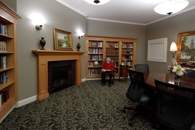 A cozy library area with a resident reading