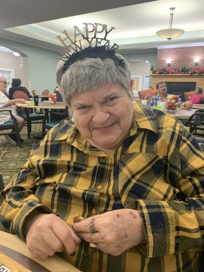 A resident celebrating New Year in a common area