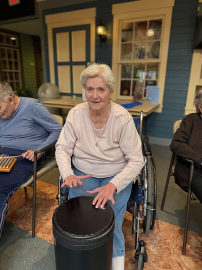 Senior woman in a wheelchair participating in an activity