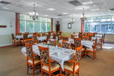 Dining room with tables set for residents