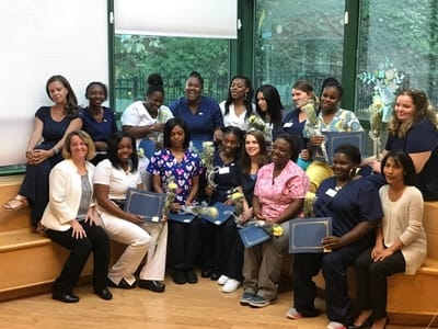 Staff members celebrating a milestone in a common area