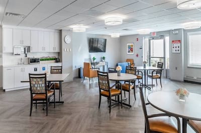 Bright dining area with tables and chairs