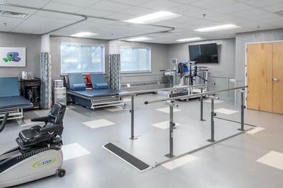 Rehabilitation gym with exercise equipment and walking bars