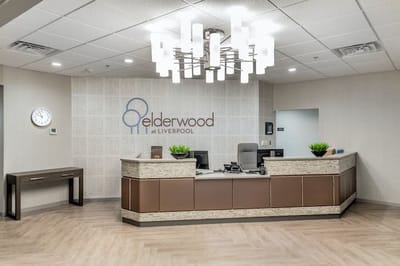 Reception area with a front desk and modern decor