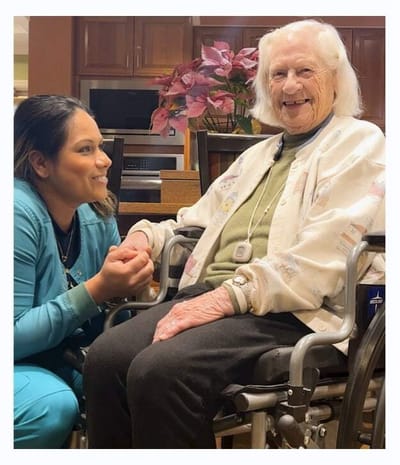 Staff member interacting with a resident in a common area