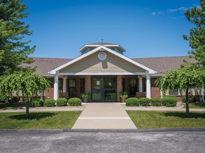 Front entrance of Luther Crest Apartments with landscaped path