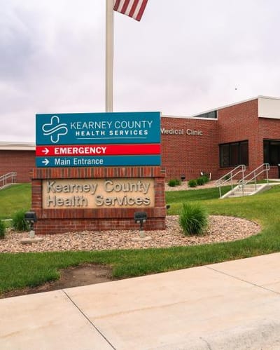Exterior view of Kearney County Health Services with sign