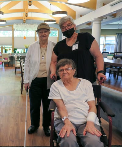 Residents and staff in a community living area