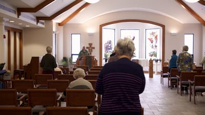 Residents attending a service in a chapel setting