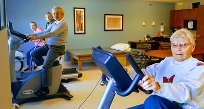 Residents engaging in exercise activities in a common area