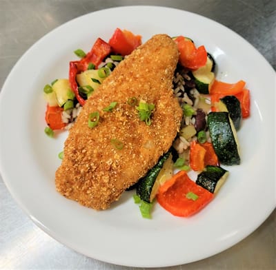 Deliciously plated fish with colorful vegetables