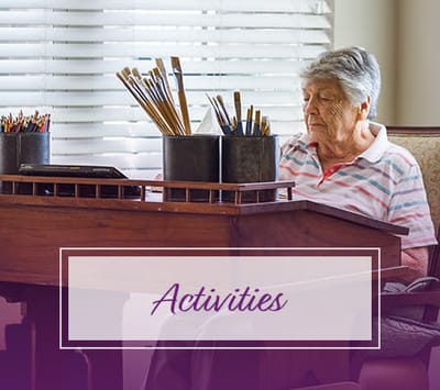 Resident participating in an art activity at a table