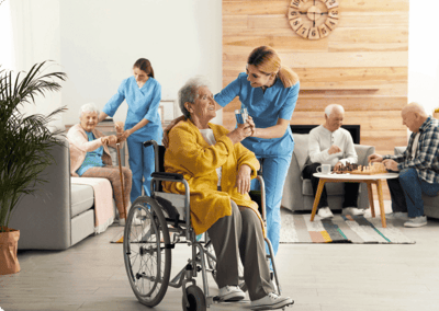 Nurse assisting a resident in a bright common area