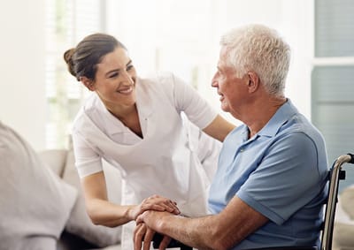 A caregiver interacting with a senior resident