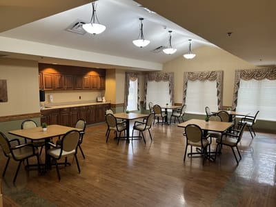 Bright dining area with tables and chairs