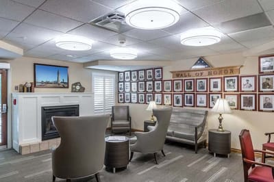 Common area with seating and a wall of honor