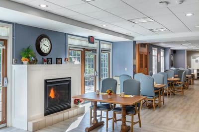 Interior view of a dining room with a fireplace