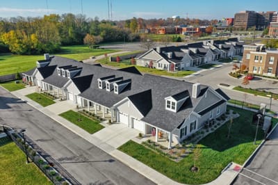 Aerial view of the senior living facility with landscaped gardens