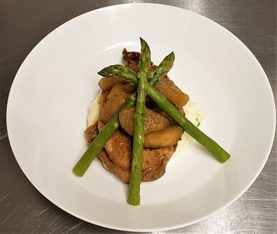 Beautifully plated meal with asparagus and apples