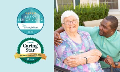 Happy resident with staff member outside