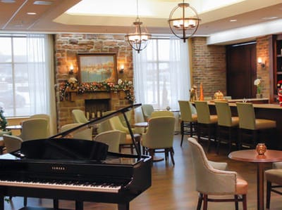 Interior view of a cozy common area with a piano