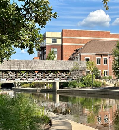 Exterior view of the facility by a serene waterway