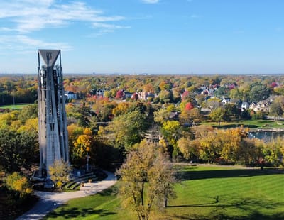 Aerial view of a landscaped park with autumn trees