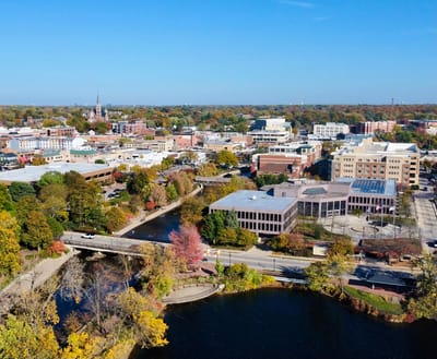 Aerial view of downtown Naperville showcasing buildings and trees