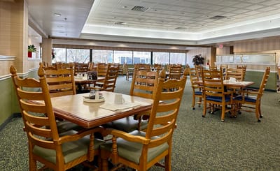 Bright and spacious dining room with wooden tables