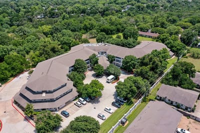 Aerial view of the Solstice Senior Living facility surrounded by trees