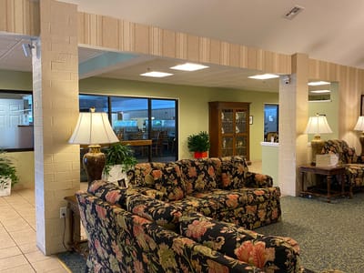 Cozy interior with floral seating and lamps