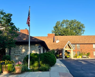 Exterior view of a senior living facility with landscaping