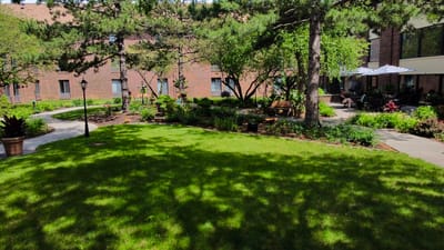 Outdoor space with benches and garden at the facility