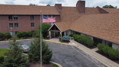 Exterior view of Independence Village with American flag