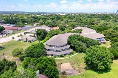Aerial view of the senior living facility surrounded by greenery