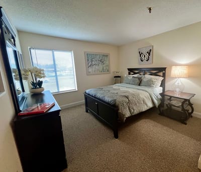 Cozy private resident room with a bed and decor