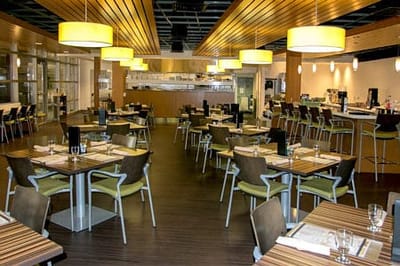 Bright dining room featuring modern furnishings and decor