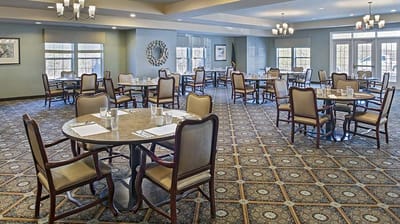 Bright dining room setup with tables and chairs