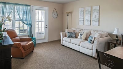 Interior view of a cozy living room with furniture.