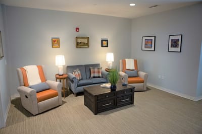 Cozy common area with seating and artwork