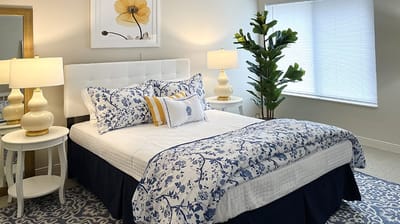 Well-decorated private resident room with flowers and lighting.