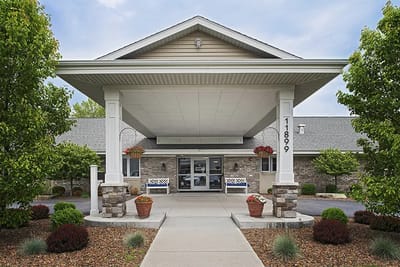 Welcome entrance of American House Wildwood with landscaping