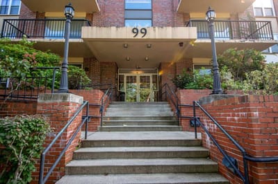 Brick exterior of the facility's entrance with steps