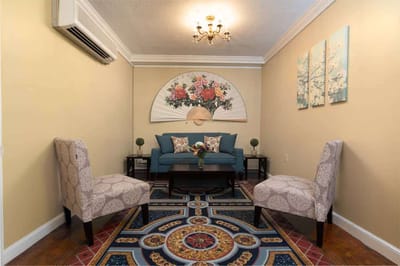 Stylish common area with floral wall decor and seating