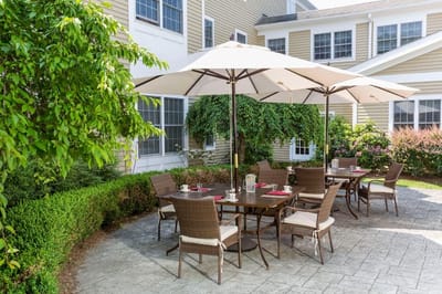 Outdoor dining space with tables and umbrellas