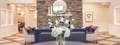 Interior view of a lobby with flowers and seating