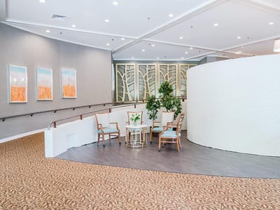 Bright interior common area with seating and plants