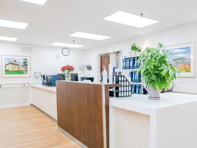 Reception area with a clean, modern design and natural light